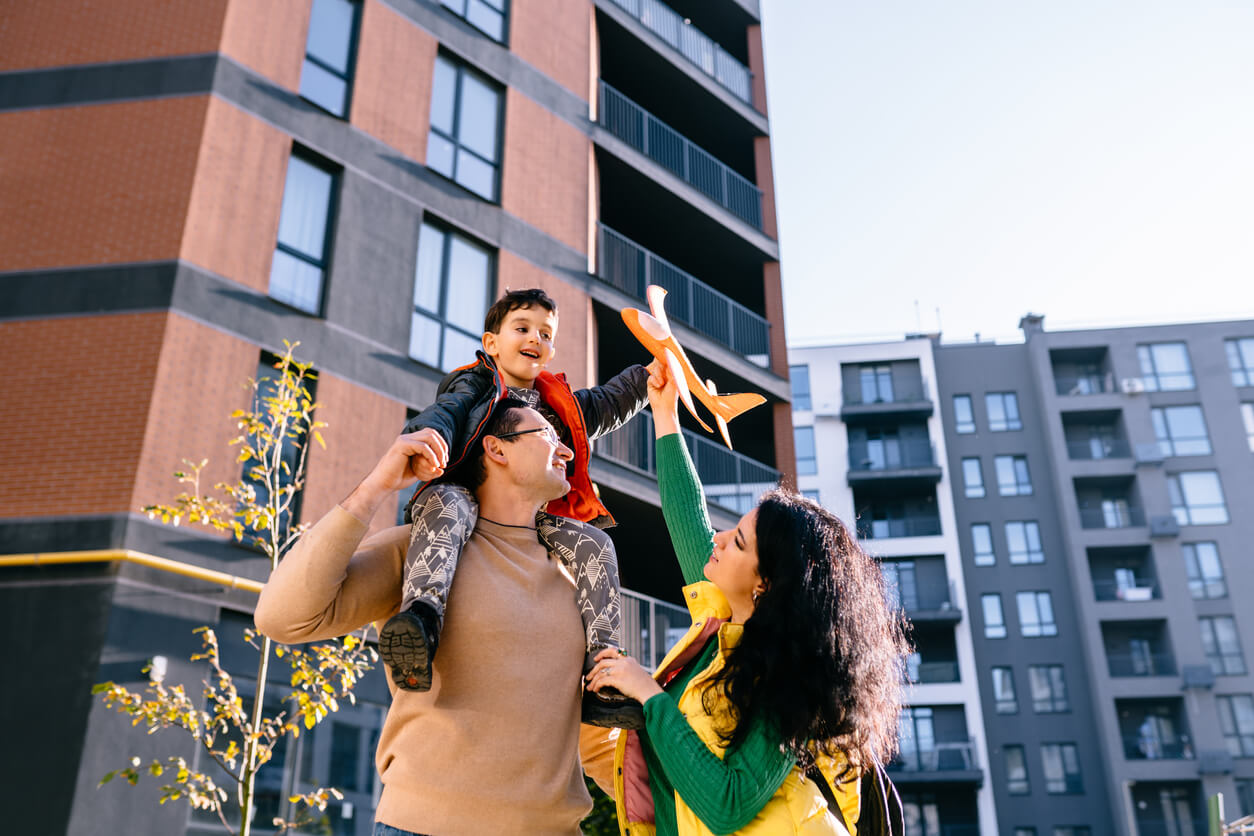 Photo of family in front of apartments for NSPIRE Inspections